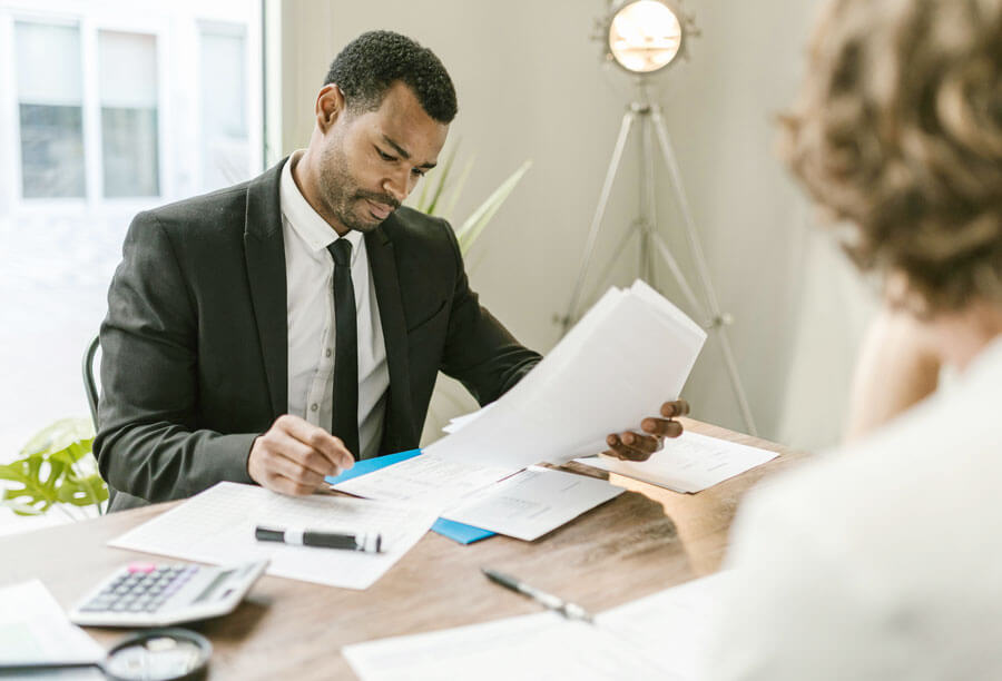 Business executive reviewing documents at a desk