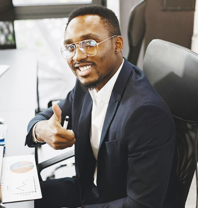 A smiling business executive sitting in an office